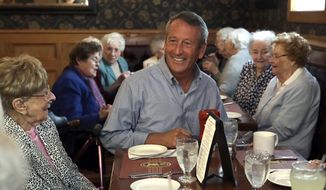 Republican presidential candidate, former South Carolina Gov. Mark Sanford, right, chats with patrons at the Puritan Backroom restaurant, during a campaign stop, Thursday, Sept. 19, 2019, in Manchester, N.H. (AP Photo/Elise Amendola) ** FILE **