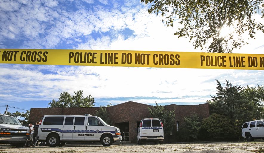 Officers from the Fort Wayne Police Department search the building that once housed an abortion clinic owned by Dr. Ulrich Klopfer on Thursday, Sept. 19, 2019, in Fort Wayne, Ind. After the doctor's death on Sept. 3, more than 2,000 medically preserved fetal remains were found in the garage of his home in rural Crete, Ill. (Eric Ginnard/The Herald-News via AP)
