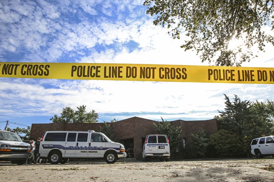 Officers from the Fort Wayne Police Department search the building that once housed an abortion clinic owned by Dr. Ulrich Klopfer on Thursday, Sept. 19, 2019, in Fort Wayne, Ind. After the doctor's death on Sept. 3, more than 2,000 medically preserved fetal remains were found in the garage of his home in rural Crete, Ill. (Eric Ginnard/The Herald-News via AP)