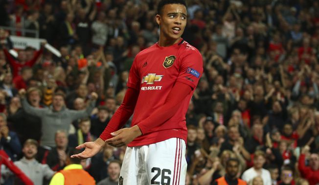 Manchester United&#x27;s Mason Greenwood celebrates scoring his sides first goal during the Europa League Group L soccer match between Manchester United and Astana at Old Trafford stadium in Manchester, England Thursday, Sept. 19, 2019. (AP Photo/Dave Thompson)