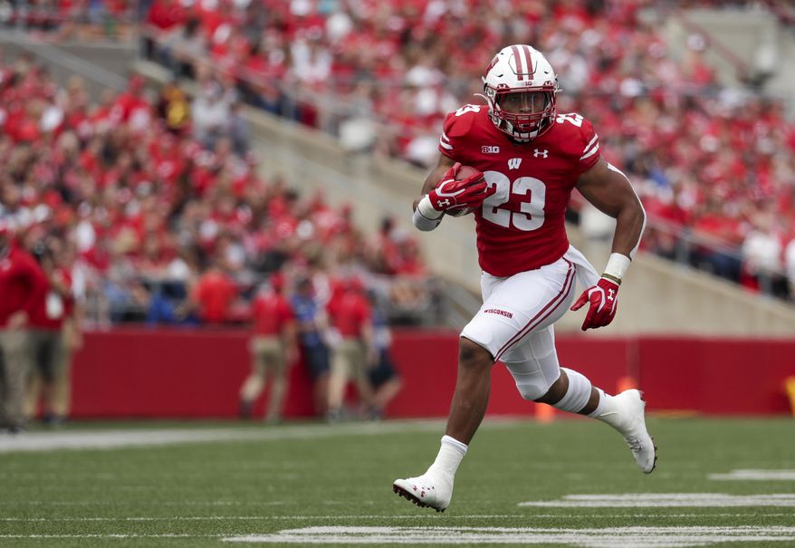 Wisconsin's Jonathan Taylor runs during the first half of an NCAA college football game against Central Michigan Saturday, Sept. 7, 2019, in Madison, Wis. (AP Photo/Morry Gash)