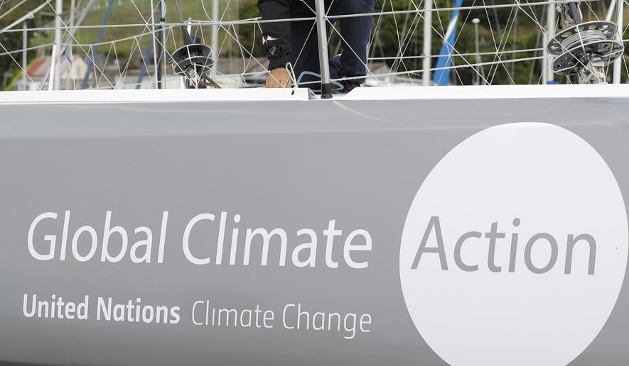 FIE - This Aug. 13, 2019, file photo, shows the boat Malizia as it is moored in Plymouth, England Tuesday, Aug. 13, 2019. A group of more than 500 major institutional investors is urging governments to do more to tackle climate change, ahead of a U.N. summit on the issue. (AP Photo/Kirsty Wigglesworth, File)