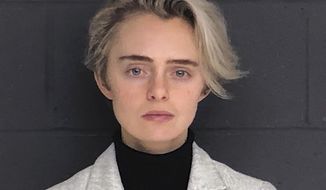 FILE - This Feb. 11, 2019, booking photo released by the Bristol County Sheriff&#39;s Office shows Michelle Carter. The Massachusetts woman sentenced to 15 months in jail for urging her suicidal boyfriend via text messages to take his own life is asking for early release. Carter is scheduled to appear Thursday, Sept. 19 before the state Parole Board after serving seven months. She was convicted in 2017 of involuntary manslaughter in the death of 18-year-old Conrad Roy III. (Bristol County Sheriff&#39;s Office via AP, File)