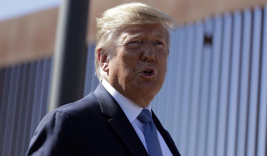 President Donald Trump talks with reporters as he tours a section of the southern border wall, Wednesday, Sept. 18, 2019, in Otay Mesa, Calif. (AP Photo/Evan Vucci) **FILE**