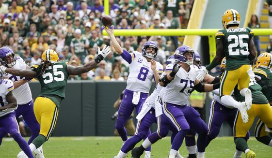 Minnesota Vikings&#39; Kirk Cousins throws during the second half of an NFL football game against the Green Bay Packers Sunday, Sept. 15, 2019, in Green Bay, Wis. (AP Photo/Mike Roemer)