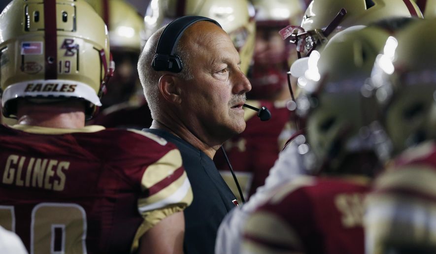 Boston College head coach Steve Addazio stands with his team during a timeout in the first half of an NCAA college football game against Kansas in Boston, Friday, Sept. 13, 2019. (AP Photo/Michael Dwyer)