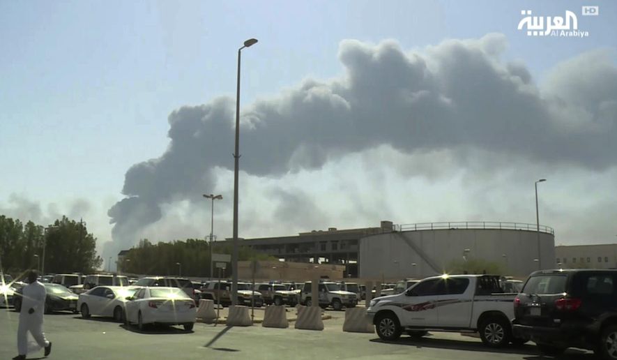In this Saturday, Sept. 14, 2019, file photo, made from a video broadcast on the Saudi-owned Al-Arabiya satellite news channel, smoke from a fire at the Abqaiq oil processing facility fills the skyline, in Buqyaq, Saudi Arabia. Saudi Arabia took journalists on Friday to the site of a missile-and-drone strike on the kingdom’s oil industry that shook global energy markets over the weekend. (Al-Arabiya via AP, File)