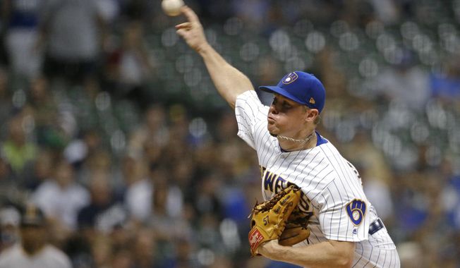 Milwaukee Brewers&#x27; Chase Anderson pitches during the first inning of the team&#x27;s baseball game against the Pittsburgh Pirates on Friday, Sept. 20, 2019, in Milwaukee. (AP Photo/Aaron Gash)