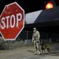 A security guard stands at an entrance to the Nevada Test and Training Range near Area 51 Friday, Sept. 20, 2019, near Rachel, Nev. People gathered at the gate inspired by the &amp;quot;Storm Area 51&amp;quot; internet hoax. (AP Photo/John Locher)