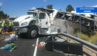 This photo released by the Garfield County Sheriff&#39;s Office shows a tour bus that was carrying Chinese-speaking tourists after it crashed near Bryce Canyon National Park in southern Utah, killing at least four people and critically injuring up to 15 others, Friday, Sept. 20, 2019. (Sheriff Danny Perkins/Garfield County Sheriff&#39;s Office via AP)