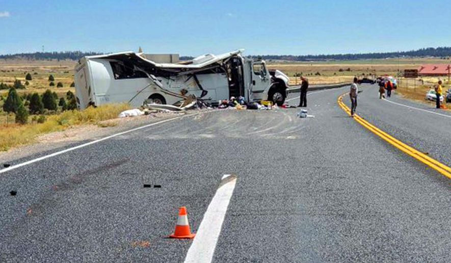 This photo released by the Utah Highway Patrol shows a tour bus carrying Chinese-speaking tourists after it crashed near Bryce Canyon National Park in southern Utah, killing at least four people and critically injuring up to 15 others, Friday, Sept. 20, 2019. (Utah Highway Patrol via AP)