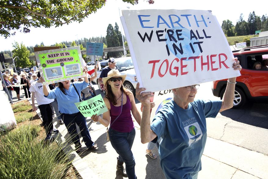 Hundreds of climate activists took to the streets of downtown Grass Valley, Calif., during Friday's global climate strike. People took part in world-wide protests of government inaction on climate change before the the U.N. Climate Action Summit on Monday. (Elias Funez/The Union via AP)