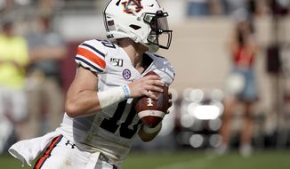 Auburn quarterback Bo Nix (10) looks down field to pass against Texas A&amp;amp;M during the first half of an NCAA college football game, Saturday, Sept. 21, 2019, in College Station, Texas. (AP Photo/Sam Craft)