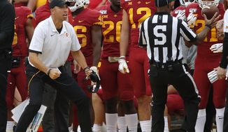 RETRANSMISSION TO CORRECT DATE - Iowa State head coach Matt Campbell, left, looks to an official for a facemask penalty against Louisiana-Monroe on the sidelines during the first half of an NCAA college football game, Saturday, Sept. 21, 2019, in Ames. (AP Photo/Matthew Putney)