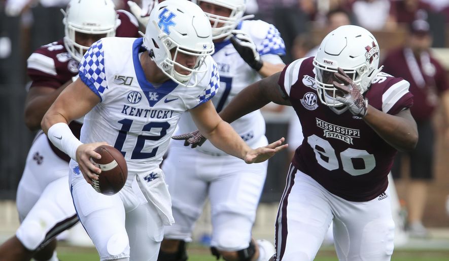 Kentucky quarterback Sawyer Smith (12) attempts to get past Mississippi State defensive tackle Lee Autry (90) during the first half of an NCAA college football game, Saturday, Sept. 21, 2019, in Starkville, Miss. (AP Photo/Kelly Donoho)