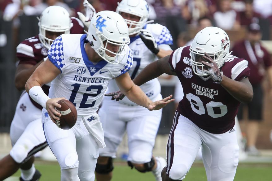 Kentucky quarterback Sawyer Smith (12) attempts to get past Mississippi State defensive tackle Lee Autry (90) during the first half of an NCAA college football game, Saturday, Sept. 21, 2019, in Starkville, Miss. (AP Photo/Kelly Donoho)