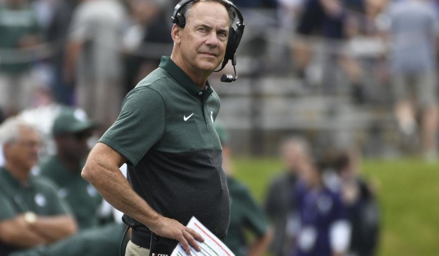 Michigan State head coach Mark Dantonio watches a play against Northwestern during the first half of an NCAA college football game, Saturday, Sept. 21, 2019, in Evanston, Ill. (AP Photo/David Banks)