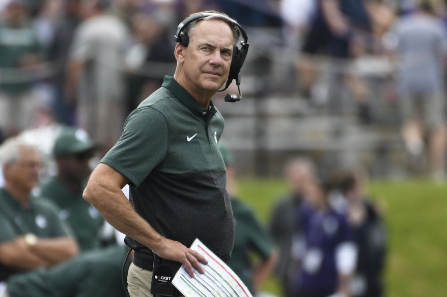 Michigan State head coach Mark Dantonio watches a play against Northwestern during the first half of an NCAA college football game, Saturday, Sept. 21, 2019, in Evanston, Ill. (AP Photo/David Banks)