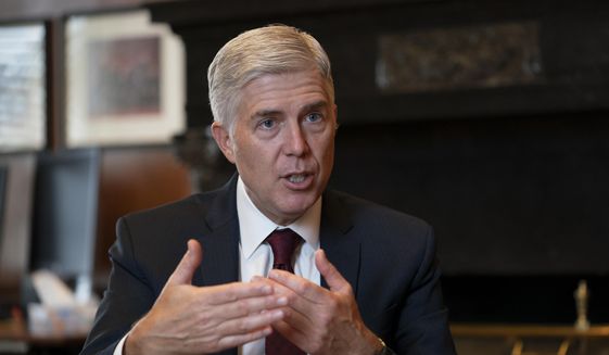 In this Sept. 4, 2019 file photo, Justice Neil Gorsuch, speaks during an interview in his chambers at the Supreme Court in Washington. (AP Photo/J. Scott Applewhite, File)