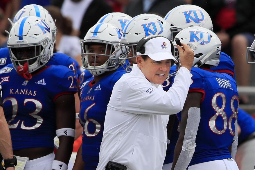 Kansas head coach Les Miles works the sidelines during the first half of an NCAA college football game against West Virginia in Lawrence, Kan., Saturday, Sept. 21, 2019. (AP Photo/Orlin Wagner)