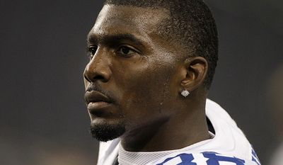 Dallas Cowboys wide receiver Dez Bryant before an NFL football game against the Seattle Seahawks, in Arlington, Texas. Bryant is free on bond after he was arrested on a misdemeanor family violence charge. Bryant turned himself in Monday afternoon, July 16, 2012,  to police in the southern Dallas suburb of DeSoto. His attorney, Royce West, says Bryant posted $1,500 bond after learning a warrant had been issued for his arrest. (AP Photo/Tony Gutierrez, File)