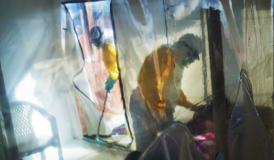 Health workers wearing protective suits tend to to an Ebola victim kept in an isolation tent in Beni, Democratic Republic of Congo, on Saturday, July 13, 2019. The Congolese health ministry is confirming the country&#x27;s first Ebola case in the provincial capital of 2 million, Goma, some 360 kilometers (225 miles) south of Beni. More than 1,600 people in eastern Congo have died as the virus has spread in areas too dangerous for health teams to access. (AP Photo/Jerome Delay)