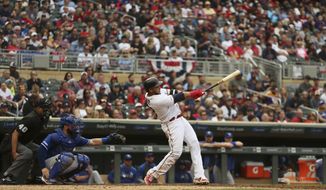 Minnesota Twins&#39; Nelson Cruz hits his 400th career home run against the Kansas City Royals in the fourth inning of a baseball game Sunday, Sept. 22, 2019, in Minneapolis. (AP Photo/Stacy Bengs)
