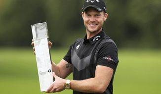 England&#39;s Danny Willett poses with the trophy after winning the PGA Championship at Wentworth Golf Club, Wentworth, England, Sunday Sept. 22, 2019. (Bradley Collyer/PA via AP)