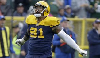 Green Bay Packers outside linebacker Preston Smith celebrates after the Denver Broncos turned over the ball on downs near the end of the second half of an NFL football game Sunday, Sept. 22, 2019, in Green Bay, Wis. (AP Photo/Mike Roemer)
