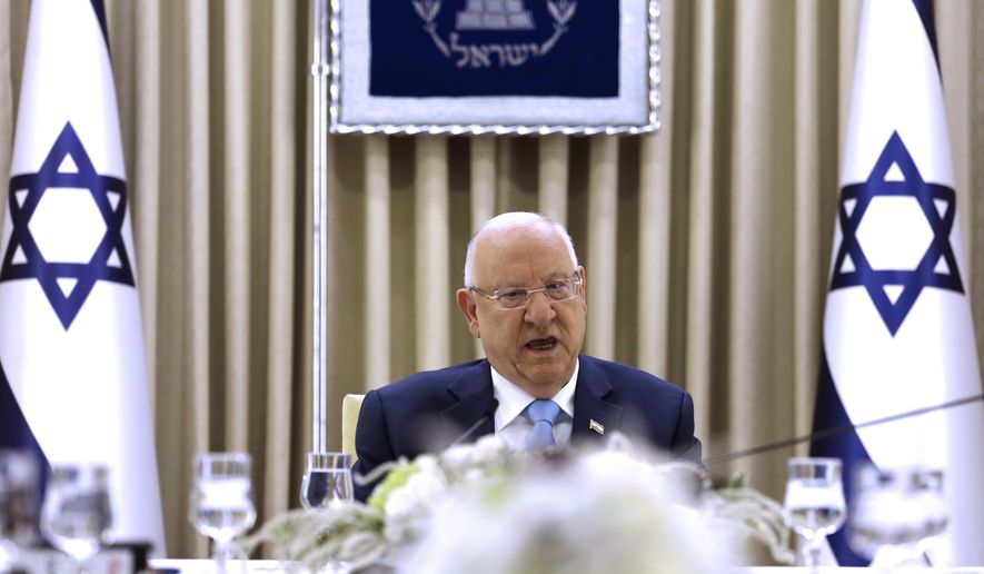 Israeli President Reuven Rivlin speaks during a consultation meeting with members of the Likud party, in Jerusalem, Sunday, Sept. 22, 2019. Rivlin began two days of crucial talks Sunday with party leaders before selecting his candidate for prime minister, after a deadlocked repeat election was set to make forming any new government a daunting task. (Menahem Kahana/Pool via AP)