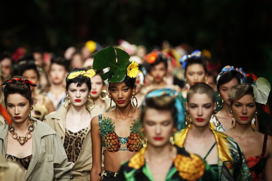 Models wear creations as part of the Dolce &amp;amp; Gabbana Spring-Summer 2020 collection, unveiled during the fashion week, in Milan, Italy, Sunday, Sept. 22, 2019. (AP Photo/Antonio Calanni)