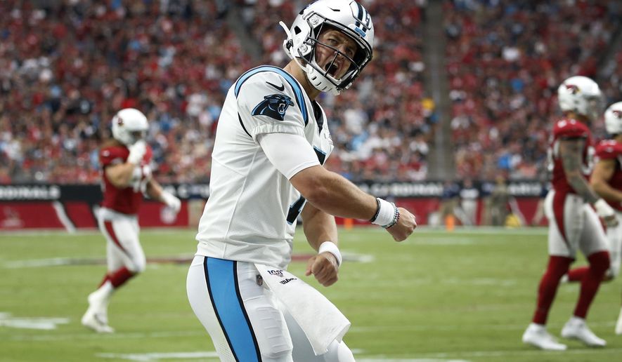 Carolina Panthers quarterback Kyle Allen (7) celebrates his touchdown pass against the Arizona Cardinals during the first half of an NFL football game, Sunday, Sept. 22, 2019, in Glendale, Ariz. (AP Photo/Ross D. Franklin)