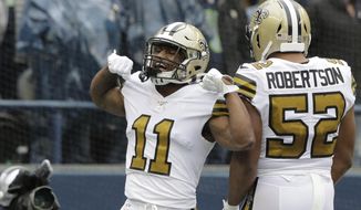 New Orleans Saints&#39; Deonte Harris (11) celebrates his touchdown on a punt return against the Seattle Seahawks during the first half of an NFL football game Sunday, Sept. 22, 2019, in Seattle. (AP Photo/Ted S. Warren)