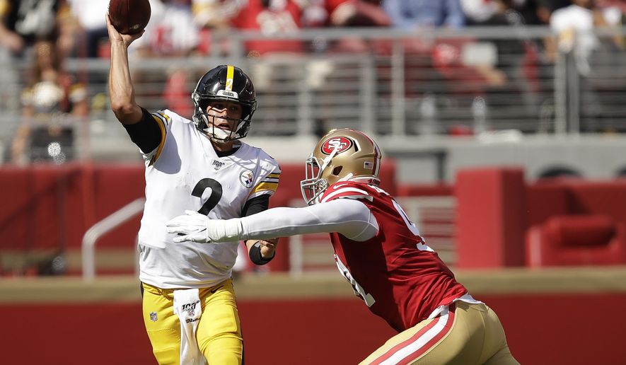 Pittsburgh Steelers quarterback Mason Rudolph (2) passes as he is pressured by San Francisco 49ers defensive end Arik Armstead during the second half of an NFL football game in Santa Clara, Calif., Sunday, Sept. 22, 2019. (AP Photo/Ben Margot)