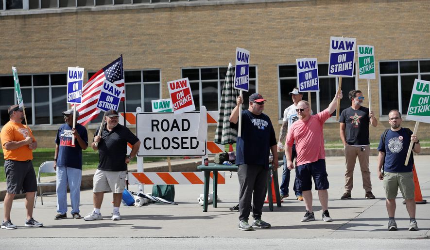 General Motors workers pickets outside the General Motors Fabrication Division, on Monday in Parma, Ohio. Some 49,000 members of the United Auto Workers&#x27; union have been on strike against General Motors since Sept. 16. (ASSOCIATED PRESS)