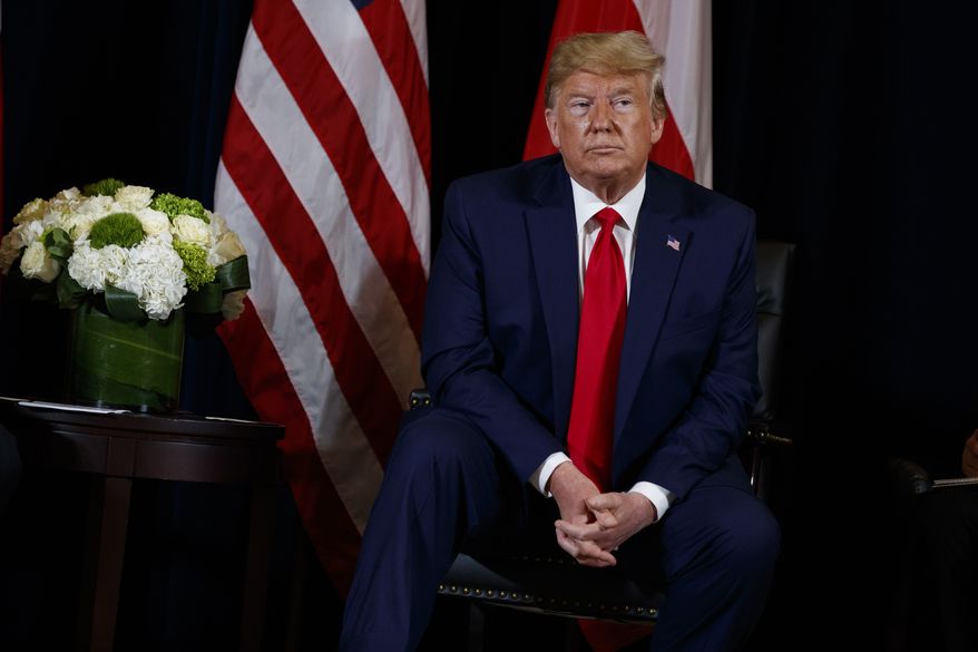 President Donald Trump listens during a meeting with Polish President Andrzej Duda at the InterContinental Barclay hotel during the United Nations General Assembly, Monday, Sept. 23, 2019, in New York. (AP Photo/Evan Vucci)