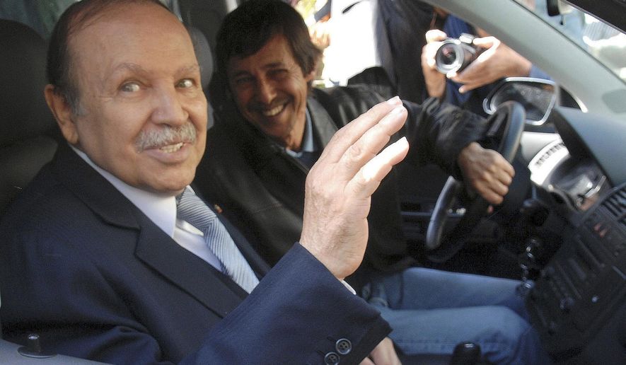 FILE - This Friday April 10, 2009 file photo shows Algerian President Abdelaziz Bouteflika, left, and his brother Said Bouteflika arrives at his campaign headquarters in the Hydra district of Algiers, a day after the Algerian presidential election. A military tribunal has opened the high-profile trial of Said Bouteflika and two ex-intelligence chiefs, one whose name alone once made Algerians tremble. (AP Photo, File)
