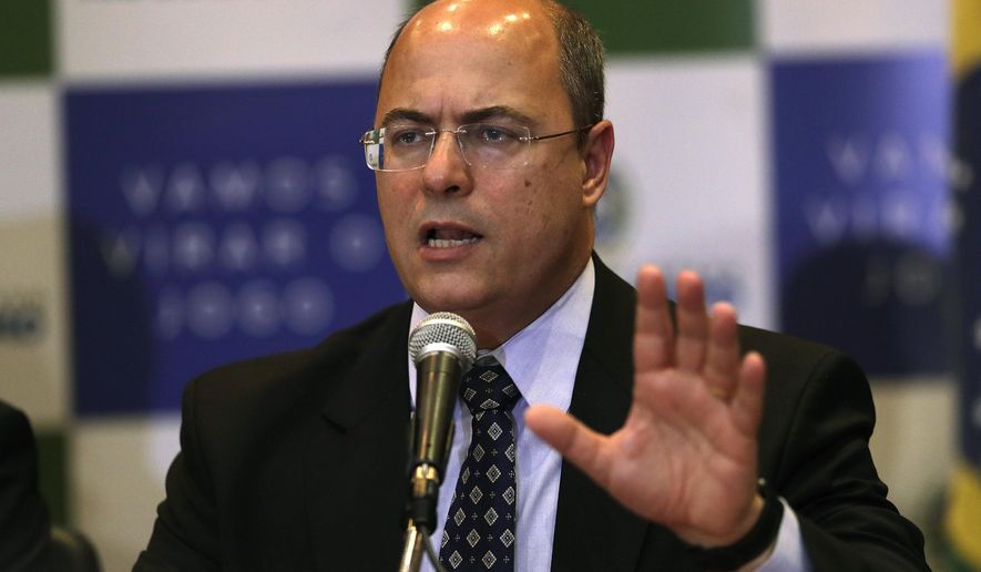 Rio de Janeiro Gov. Wilson Witzel gives a news conference concerning the death of an 8-year-old girl in Rio de Janeiro, Brazil, Monday, Sept. 23, 2019. Ágatha Sales Félix died Friday after she was shot in the back while riding in a van in the Complexo do Alemao slum. (AP Photo/Silvia Izquierdo)