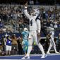 Dallas Cowboys quarterback Dak Prescott (4) celebrates his touchdown run against the Miami Dolphins in the second half of an NFL football game in Arlington, Texas, Sunday, Sept. 22, 2019. (AP Photo/Ron Jenkins)