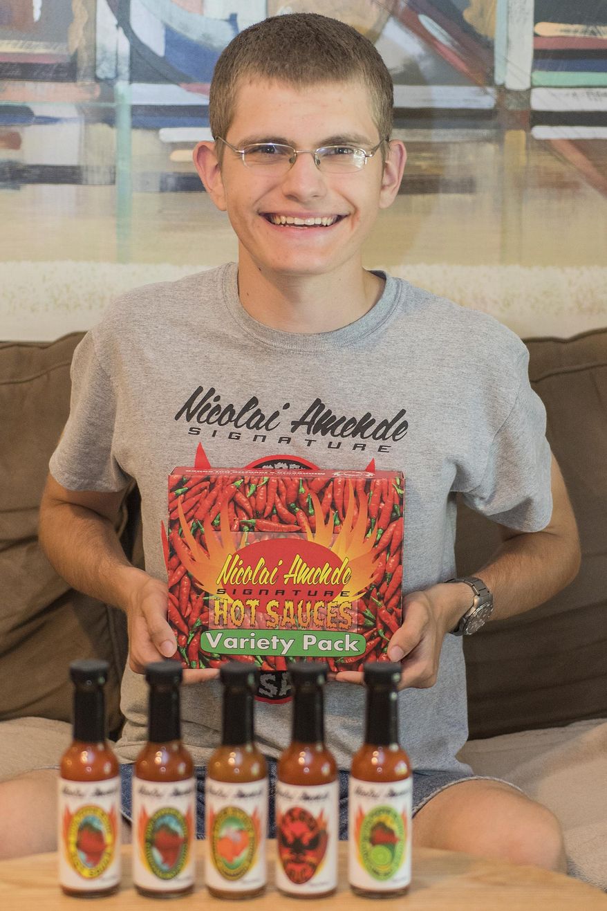 Nicolai Amende started Nicolai Amende Signature Hot Sauces seven years ago. His hot sauces can be found at Hilltop Meat Market, Wooden Spoon, Blue Sky Mercantile, Welsh Heritage Farms, Cheese and Pie Mongers in St. Peter and the Yellow Barn. (Jackson Forderer/The Free Press via AP)