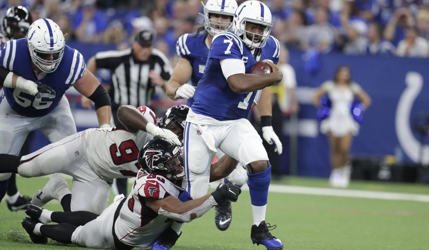 Indianapolis Colts quarterback Jacoby Brissett (7) runs out of the tackle of Atlanta Falcons defensive tackle Jack Crawford (95) during the second half of an NFL football game against the Atlanta Falcons, Sunday, Sept. 22, 2019, in Indianapolis. (AP Photo/Michael Conroy)