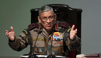 FILE- In this Jan.12, 2018 file photo, Indian Army Chief Bipin Rawat speaks during a press conference in New Delhi, India. Rawat says Pakistan has reactivated militant camps in Pakistan-held Kashmir and about 500 militants are waiting to infiltrate into India. (AP Photo, File)