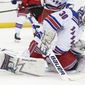 New York Rangers goaltender Henrik Lundqvist makes a save during the second period of the team&#39;s preseason NHL hockey game against the New Jersey Devils, Friday, Sept. 20, 2019, in Newark, N.J. (AP Photo/Mary Altaffer)
