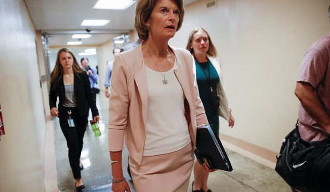 &quot;There is a line here that I believe has been overstepped,&quot; Sen. Lisa Murkowski, Alaska Republican, said about rebuking President Trump and the national emergency funds. (Associated Press)