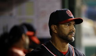 Washington Nationals manager Dave Martinez walks in the dugout in the sixth inning of the second baseball game of a doubleheader against the Philadelphia Phillies, Tuesday, Sept. 24, 2019, in Washington. (AP Photo/Patrick Semansky)