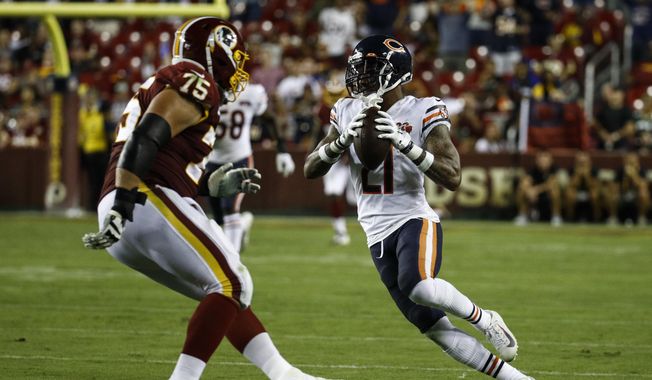 Chicago Bears strong safety Ha Ha Clinton-Dix (21) runs with his interception in front of Washington Redskins offensive guard Brandon Scherff (75) during the second half of an NFL football game Monday, Sept. 23, 2019, in Landover, Md. (AP Photo/Patrick Semansky) **FILE**