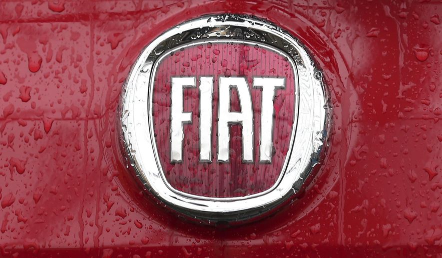 FILE - In this Thursday, Jan. 2, 2014 file photo, a Fiat logo pictured on a car in Milan, Italy. A top European court has ruled that automaker Fiat will have to pay up to 30 million euros, 33 million US dollars, in back taxes to Luxembourg. The Luxembourg-based General Court ruled Tuesday, Sept. 24, 2019, that the EU's anti-trust regulator, the European Commission, had acted correctly in 2015 when it ordered Fiat Chrysler Finance Europe to return the tax break. (AP Photo/Antonio Calanni, File)