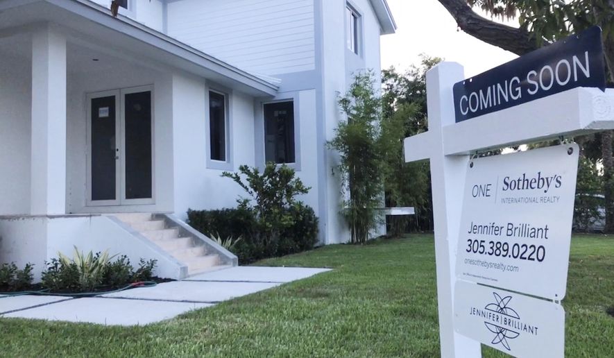 In this Aug. 21, 2019, photo, a newly built home coming on the market soon is shown in Surfside, Fla. On Tuesday, Sept. 24, the Standard & Poor's/Case-Shiller 20-city home price index for July is released. (AP Photo/Wilfredo Lee)