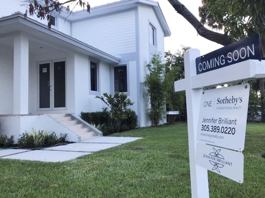 In this Aug. 21, 2019, photo, a newly built home coming on the market soon is shown in Surfside, Fla. On Tuesday, Sept. 24, the Standard & Poor's/Case-Shiller 20-city home price index for July is released. (AP Photo/Wilfredo Lee)