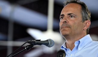 FILE - In this Aug. 3, 2019 file photo, Kentucky republican candidate for Governor, Gov. Matt Bevin, addresses the audience gathered at the Fancy Farm Picnic in Fancy Farm, Ky.  Bevin touted the reliability of fossil fuels and called teen climate activist Greta Thunberg &amp;quot;remarkably ill-informed&amp;quot; during a conference on energy, a day after the teen gave an impassioned speech at the United Nations. (AP Photo/Timothy D. Easley, File)
